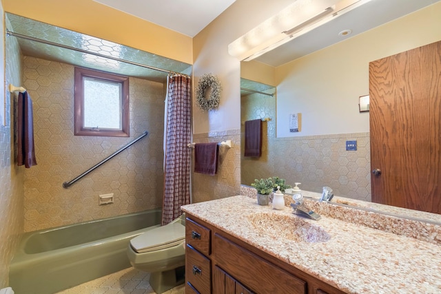 full bathroom featuring vanity, shower / bath combo, a wainscoted wall, toilet, and tile walls