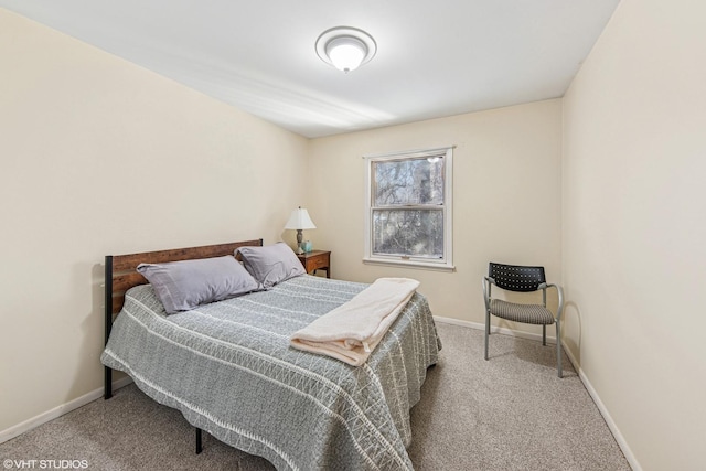 bedroom with baseboards and carpet floors