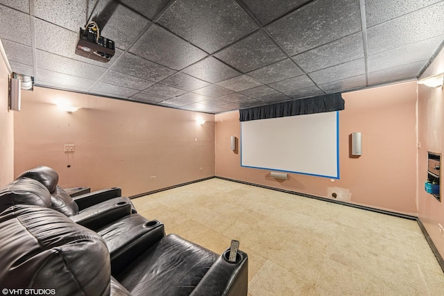home theater with baseboards and a drop ceiling
