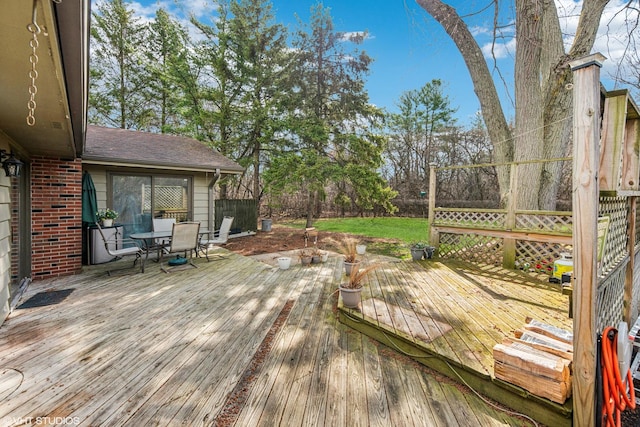 deck with outdoor dining area