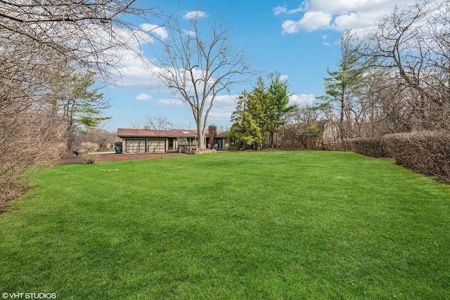 view of yard featuring a garage