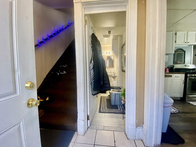 interior space with visible vents and light tile patterned flooring
