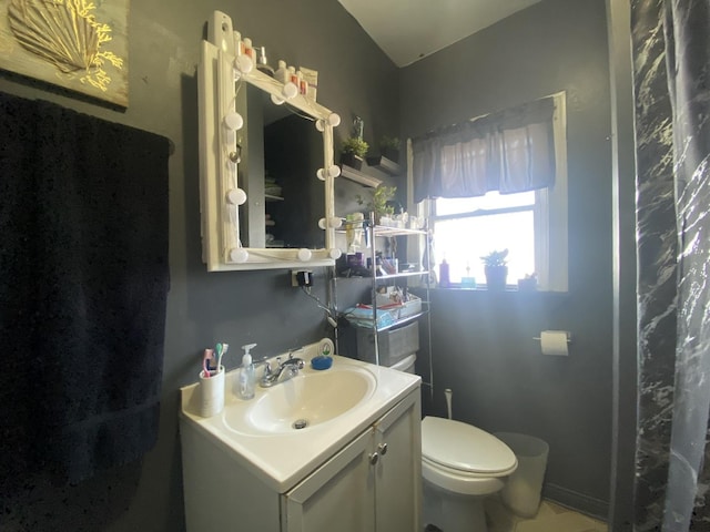 full bathroom with vanity and toilet