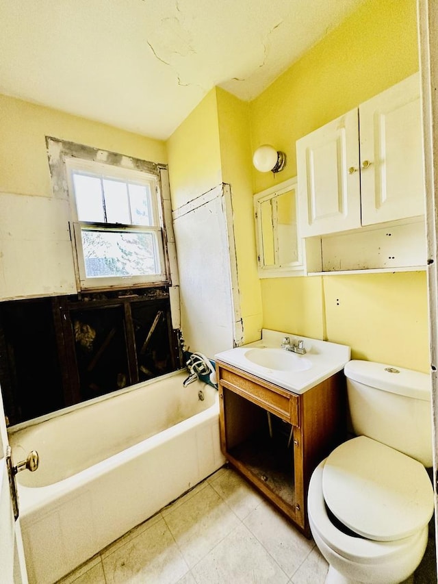 full bath featuring tile patterned floors, vanity, a bathtub, and toilet