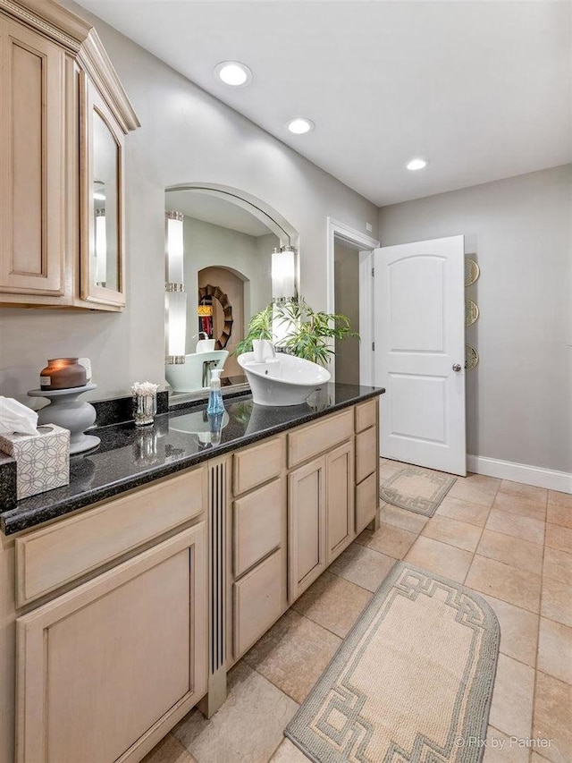 bathroom featuring vanity, recessed lighting, baseboards, and tile patterned floors