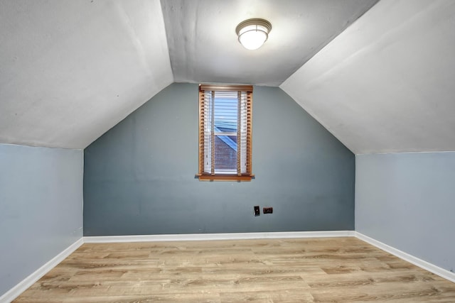 11549 S Kilbourn Ave, Alsip, IL 60803 - additional living space with baseboards, wood finished floors, and lofted ceiling