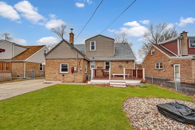11549 S Kilbourn Ave, Alsip, IL 60803 - back of property with a chimney, brick siding, fence, and a lawn