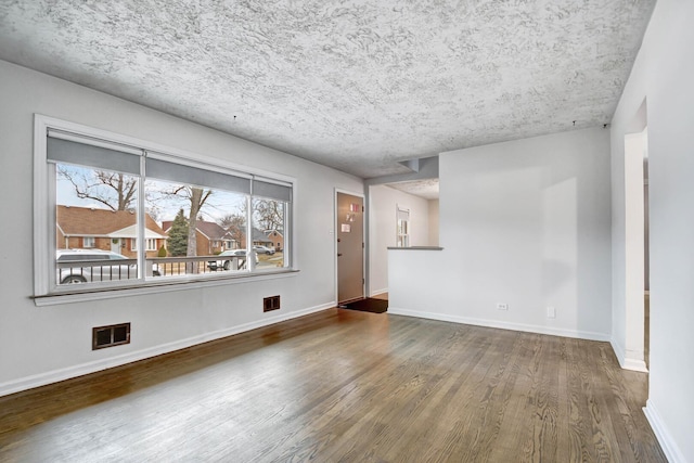 11549 S Kilbourn Ave, Alsip, IL 60803 - unfurnished living room featuring visible vents, baseboards, and wood finished floors