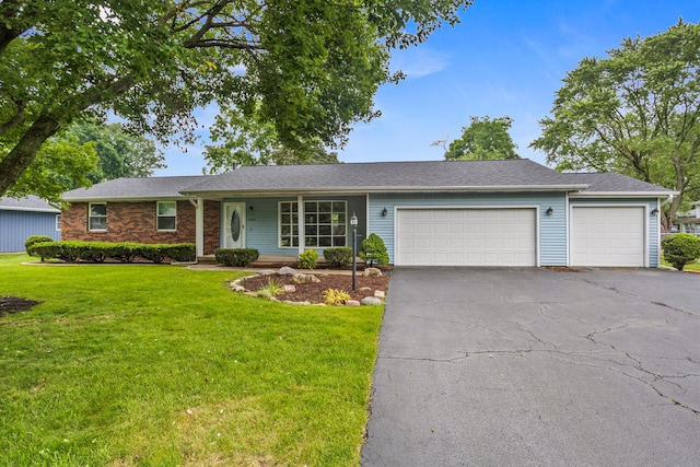 2409 Valkar Ln, Champaign, IL 61822 - ranch-style home with an attached garage, driveway, and a front yard