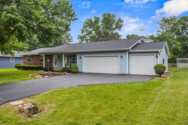 2409 Valkar Ln, Champaign, IL 61822 - ranch-style house featuring a garage, driveway, and a front lawn