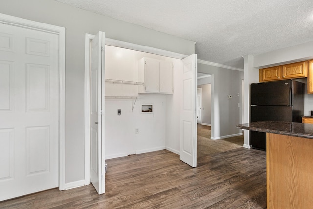 2409 Valkar Ln, Champaign, IL 61822 - kitchen with freestanding refrigerator, dark wood-style floors, a textured ceiling, baseboards, and dark stone counters