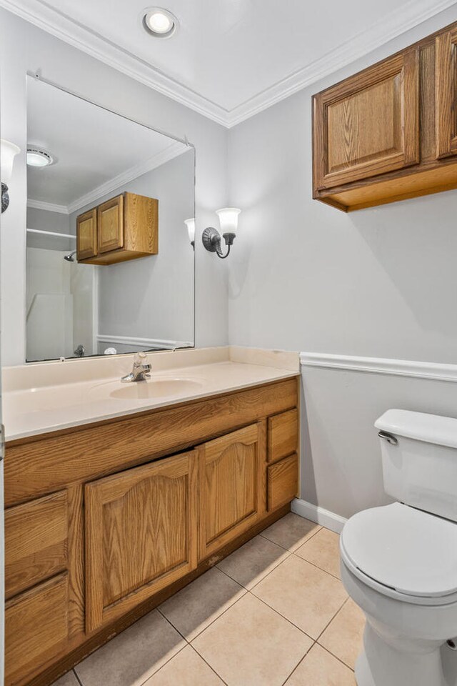 2409 Valkar Ln, Champaign, IL 61822 - full bathroom with vanity, toilet, ornamental molding, tile patterned floors, and baseboards