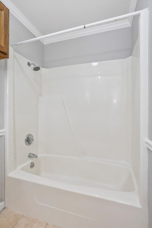2409 Valkar Ln, Champaign, IL 61822 - bathroom featuring shower / tub combination, tile patterned flooring, and ornamental molding