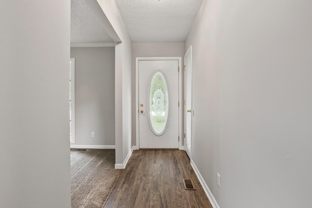 2409 Valkar Ln, Champaign, IL 61822 - entryway with a textured ceiling, baseboards, and dark wood-type flooring