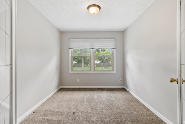 2409 Valkar Ln, Champaign, IL 61822 - carpeted empty room featuring a textured ceiling and baseboards