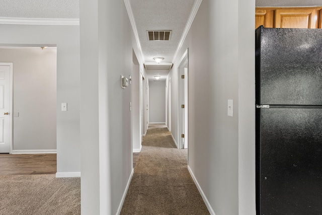 2409 Valkar Ln, Champaign, IL 61822 - hallway featuring carpet, a textured ceiling, crown molding, baseboards, and attic access