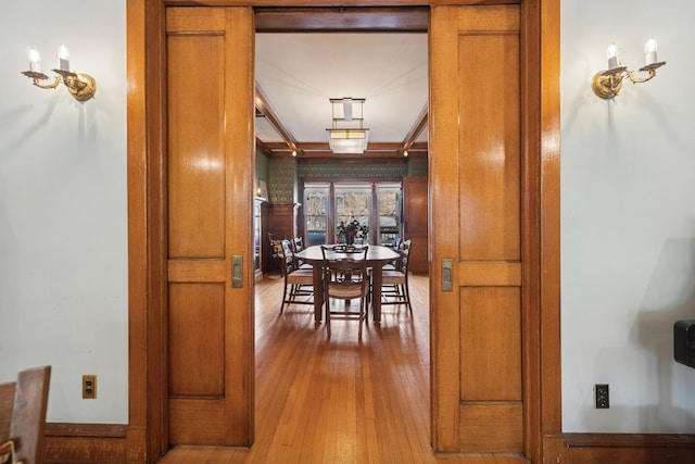 dining area featuring hardwood / wood-style flooring and baseboards