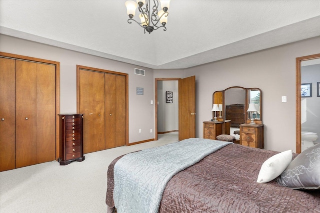 15306 S Heritage Dr, Plainfield, IL 60544 - bedroom with visible vents, a chandelier, a textured ceiling, carpet floors, and multiple closets