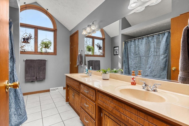 15306 S Heritage Dr, Plainfield, IL 60544 - bathroom featuring a sink, visible vents, tile patterned flooring, and lofted ceiling