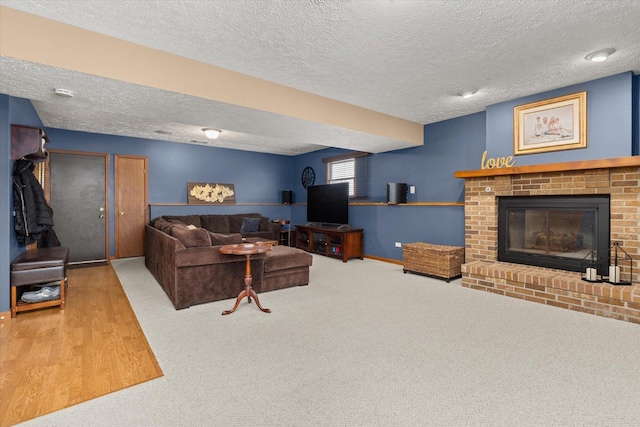 15306 S Heritage Dr, Plainfield, IL 60544 - carpeted living area with baseboards, a textured ceiling, and a fireplace