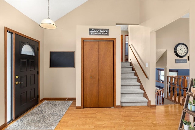 15306 S Heritage Dr, Plainfield, IL 60544 - entrance foyer featuring high vaulted ceiling, stairway, baseboards, and wood finished floors