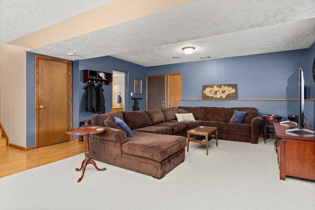 15306 S Heritage Dr, Plainfield, IL 60544 - living area featuring visible vents, a textured ceiling, baseboards, and wood finished floors