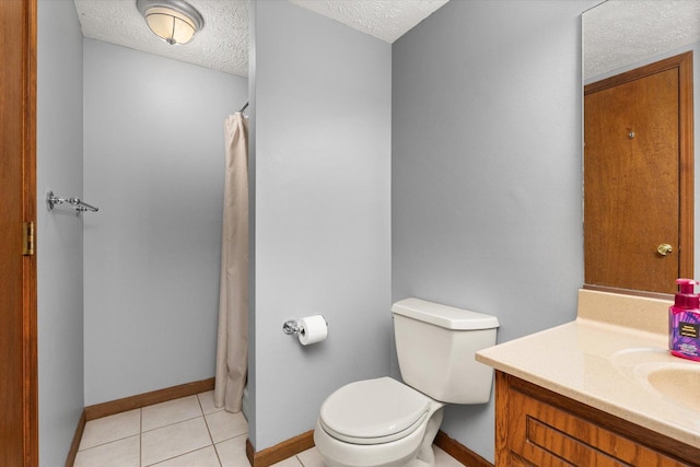 15306 S Heritage Dr, Plainfield, IL 60544 - full bathroom with a textured ceiling, vanity, tile patterned flooring, toilet, and baseboards