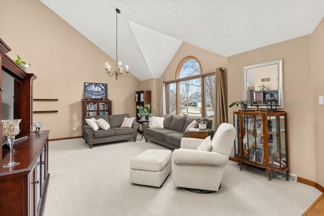 15306 S Heritage Dr, Plainfield, IL 60544 - living area featuring baseboards, high vaulted ceiling, a chandelier, and light carpet