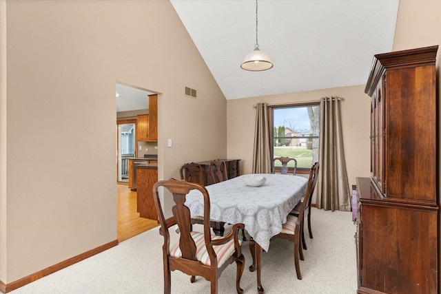15306 S Heritage Dr, Plainfield, IL 60544 - dining room with high vaulted ceiling, light colored carpet, baseboards, and visible vents