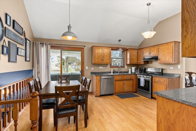 15306 S Heritage Dr, Plainfield, IL 60544 - kitchen featuring brown cabinetry, appliances with stainless steel finishes, a sink, and dark countertops