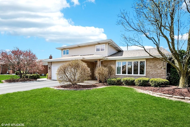 681 Vanderbilt Dr, New Lenox, IL 60451 - traditional home with a garage, aphalt driveway, brick siding, and a front yard