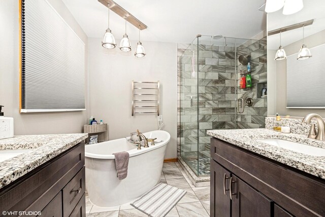 681 Vanderbilt Dr, New Lenox, IL 60451 - bathroom featuring two vanities, a sink, marble finish floor, and a stall shower