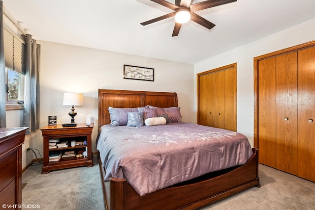 681 Vanderbilt Dr, New Lenox, IL 60451 - bedroom with light colored carpet, a ceiling fan, and multiple closets