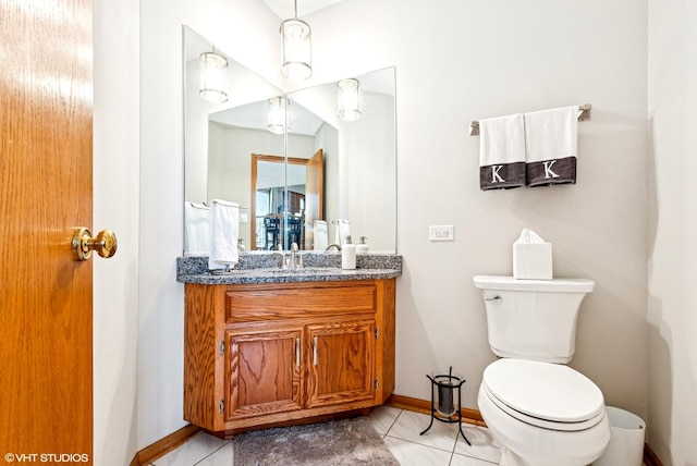 681 Vanderbilt Dr, New Lenox, IL 60451 - bathroom with baseboards, tile patterned flooring, toilet, and vanity