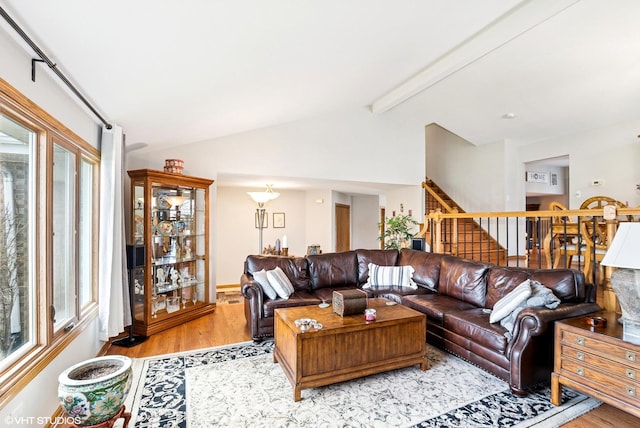 681 Vanderbilt Dr, New Lenox, IL 60451 - living room featuring vaulted ceiling with beams, light wood finished floors, plenty of natural light, and stairs