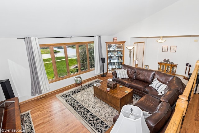 681 Vanderbilt Dr, New Lenox, IL 60451 - living area with baseboards, vaulted ceiling, and wood finished floors