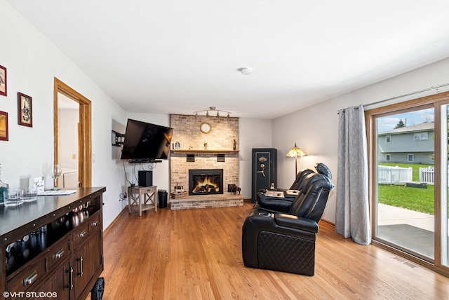 681 Vanderbilt Dr, New Lenox, IL 60451 - living area with visible vents, light wood finished floors, and a fireplace