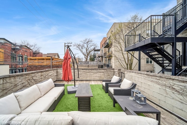 exterior space with stairs, an outdoor living space, and a wooden deck