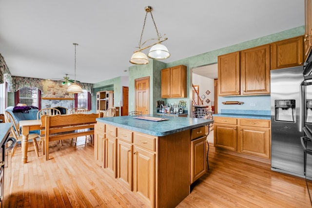 1581 Hunting Hound Ln, Bartlett, IL 60103 - kitchen featuring hanging light fixtures, light wood-style floors, a center island, and stainless steel fridge