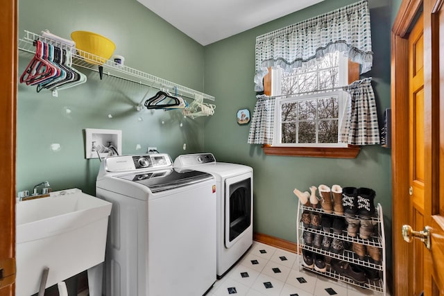 1581 Hunting Hound Ln, Bartlett, IL 60103 - washroom featuring separate washer and dryer, baseboards, tile patterned floors, laundry area, and a sink