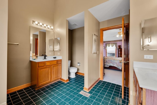 1581 Hunting Hound Ln, Bartlett, IL 60103 - ensuite bathroom with vanity, baseboards, toilet, connected bathroom, and ceiling fan