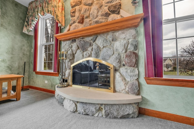 1581 Hunting Hound Ln, Bartlett, IL 60103 - interior details featuring a stone fireplace, baseboards, and carpet flooring