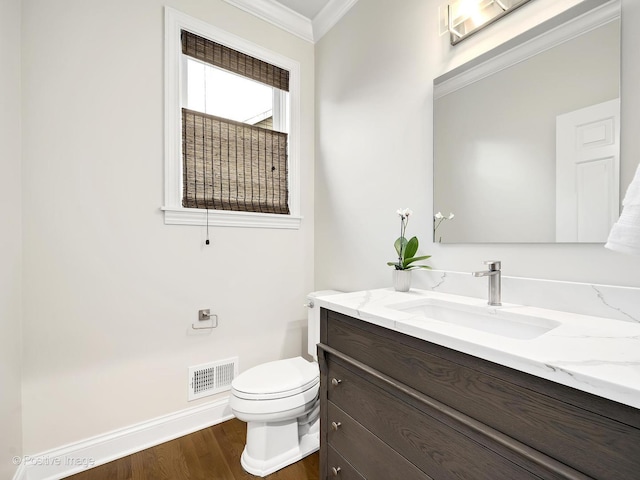 4716 Wallbank Ave, Downers Grove, IL 60515 - half bathroom with vanity, crown molding, toilet, visible vents, and wood finished floors