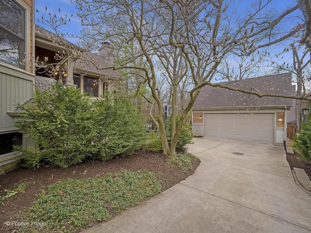 4716 Wallbank Ave, Downers Grove, IL 60515 - view of home's exterior featuring driveway, a chimney, and an attached garage