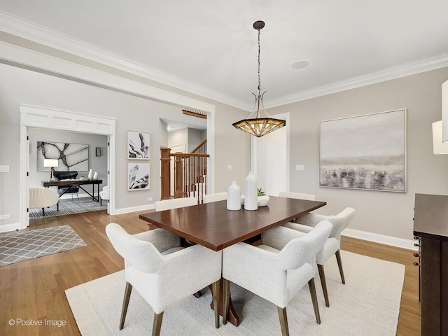 4716 Wallbank Ave, Downers Grove, IL 60515 - dining area featuring light wood-type flooring, crown molding, baseboards, and stairway