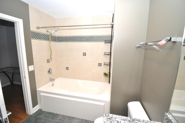 bathroom with toilet and tub / shower combination