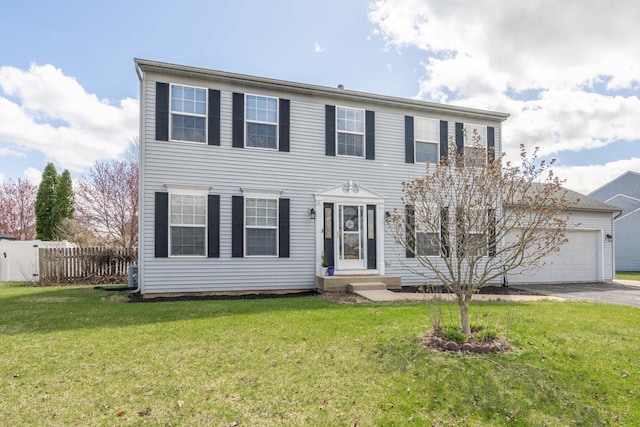 colonial home featuring aphalt driveway, a front yard, entry steps, a garage, and fence