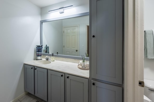 bathroom featuring tile patterned flooring and vanity