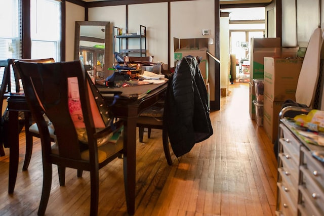 dining space with wood-type flooring