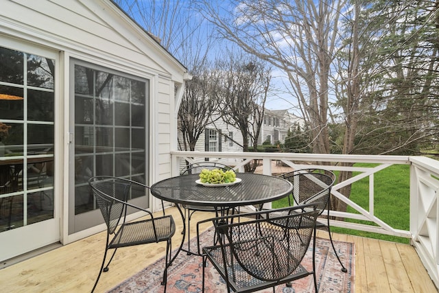 wooden deck with outdoor dining area